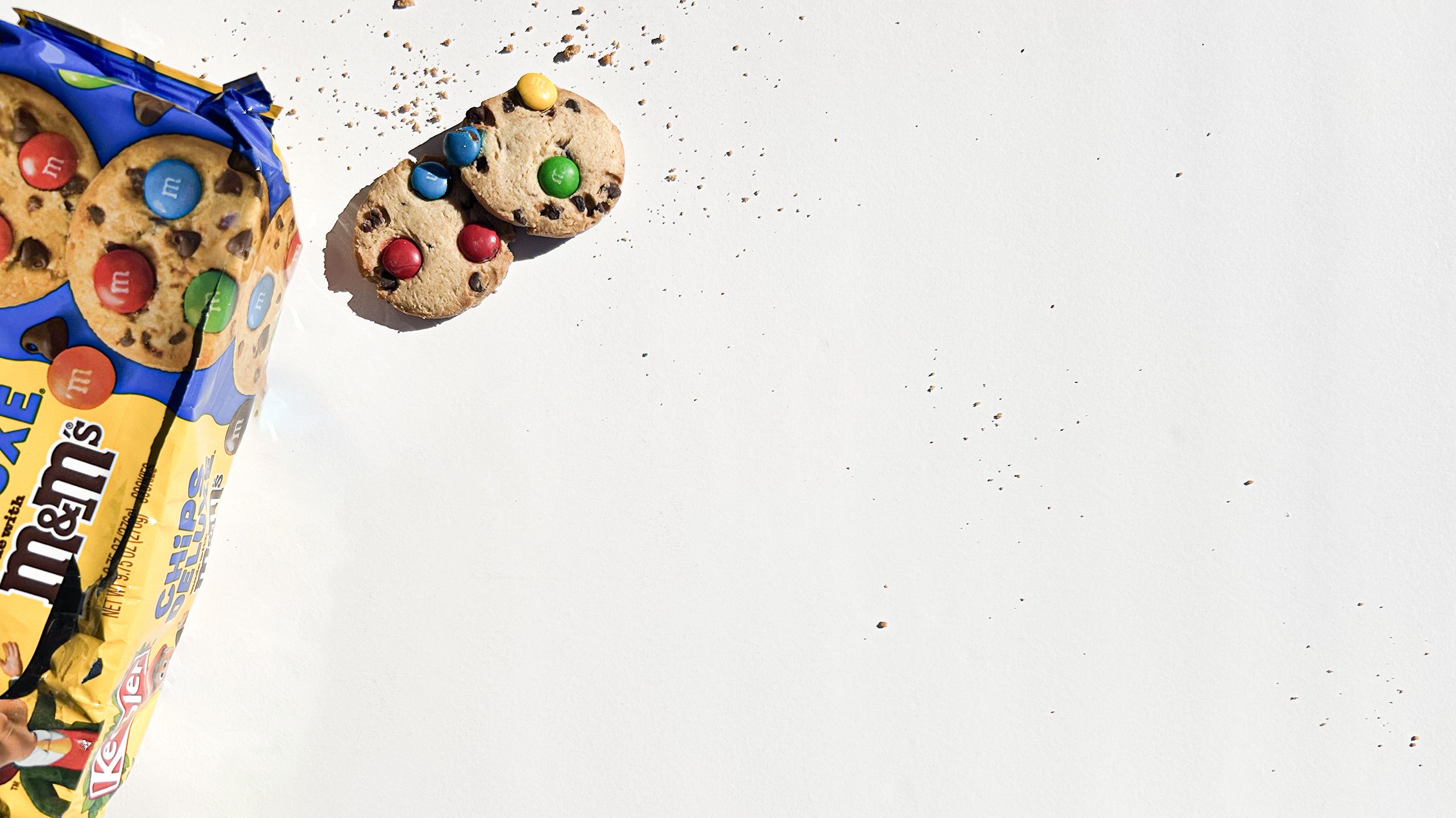 Open package of Keebler Chips Deluxe with cookies on a white background