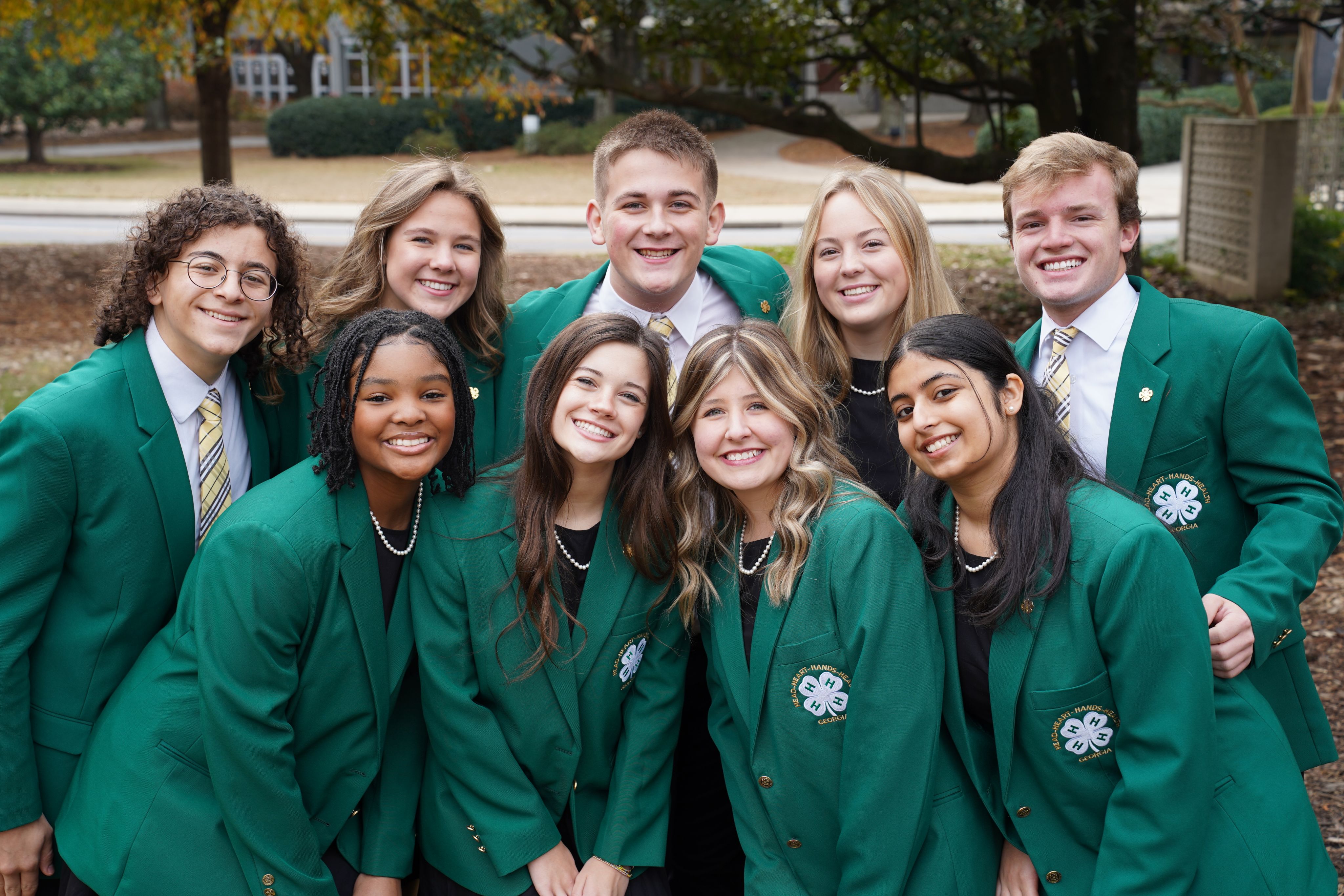 The 2022-23 Georgia 4-H State Board of Directors, composed of nine students gathers in their green blazers